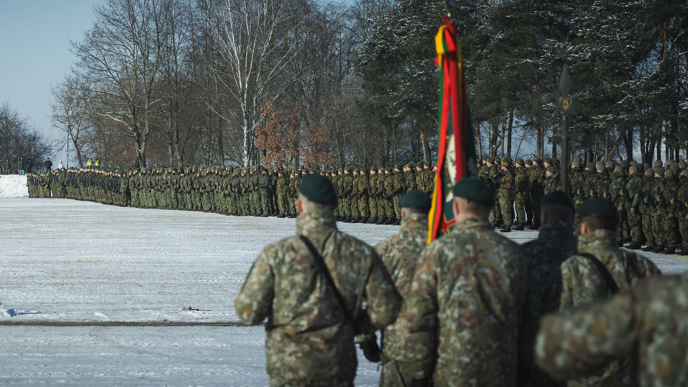 Soldiers of Panzerbrigade 45 and the Multinational Battlegroup Lithuania in formation on a snow-covered parade ground during the integration ceremony in Kaunas, Lithuania, February 2026.