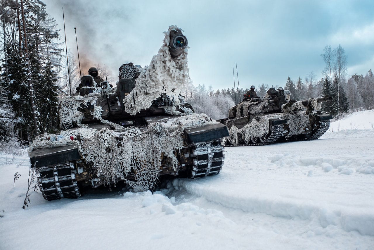 British Army Challenger 2 main battle tanks advance down a road near Tapa, Estonia. During the NATO exercise Winter Camp. Source: NATO
