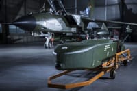 Germany's Taurus KEPD 350 missile in hangar with Tornado aircraft, representing Berlin's withheld long-range strike capability.
