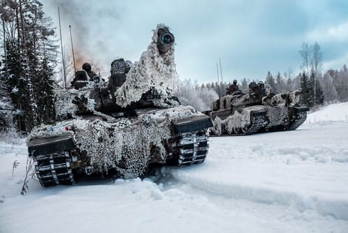British Army Challenger 2 main battle tanks advance down a road near Tapa, Estonia. During the NATO exercise Winter Camp. Source: NATO